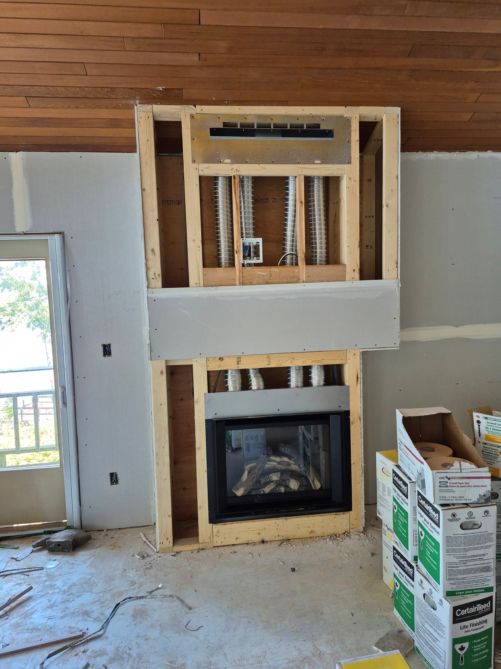 Fireplace rough-in framing with vent pipes