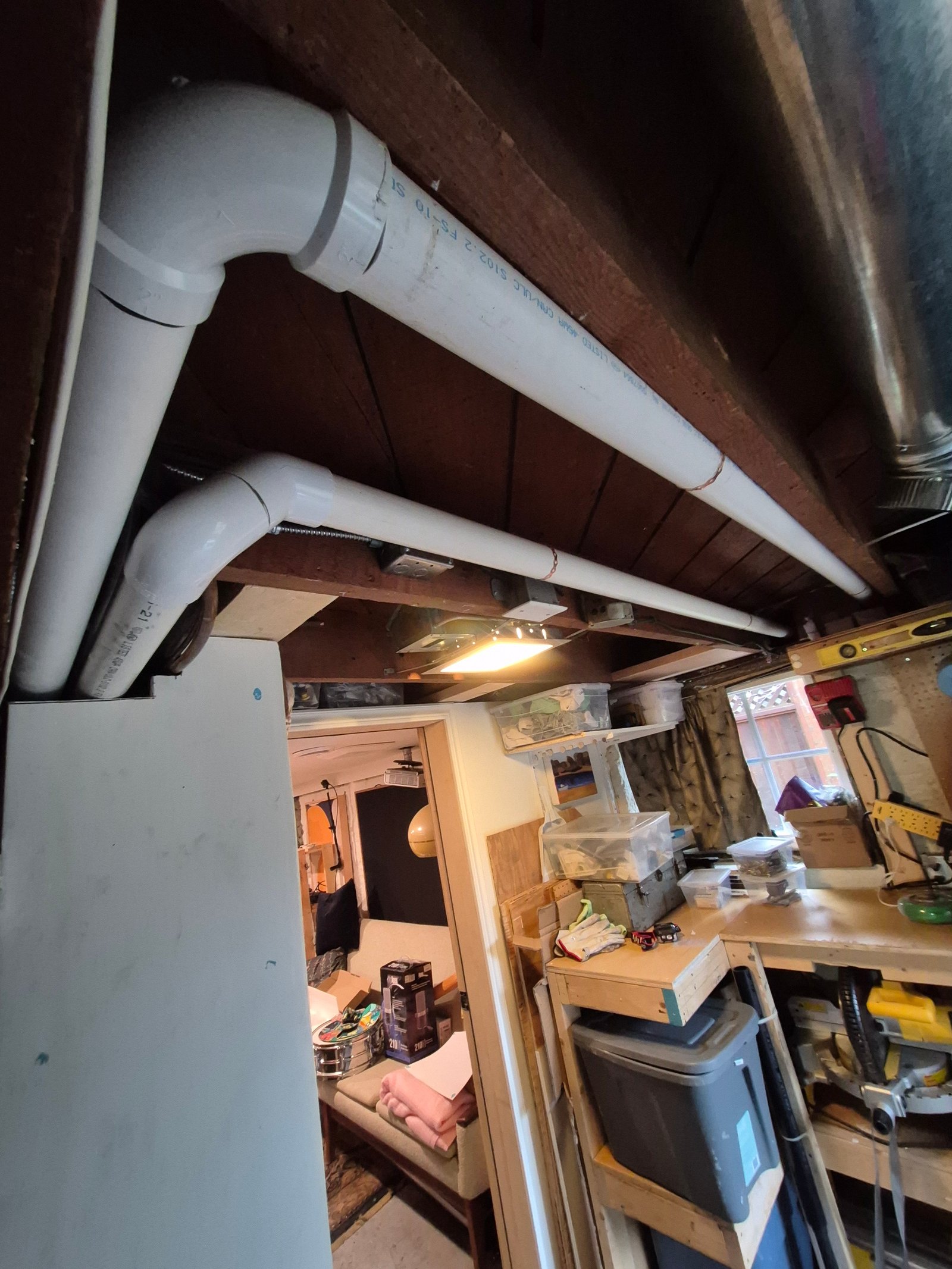 Gas line rough-in along a basement ceiling